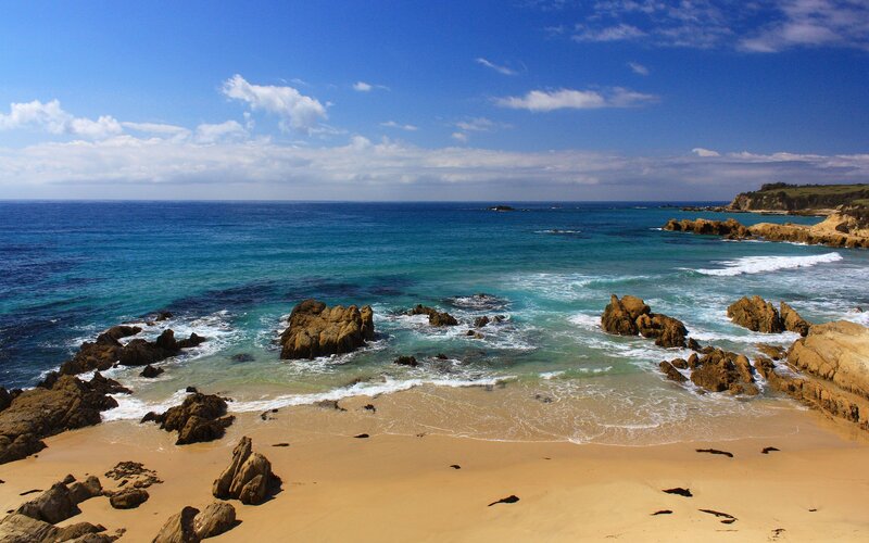 Rocky Beach with Ocean — Blue, Serene, Afternoon, Photograph, Rocks, Sand, Sky