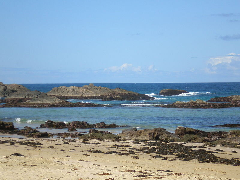 Rocky Beach with Ocean — Blue, Serene, Afternoon, Photograph, Rocks, Sand