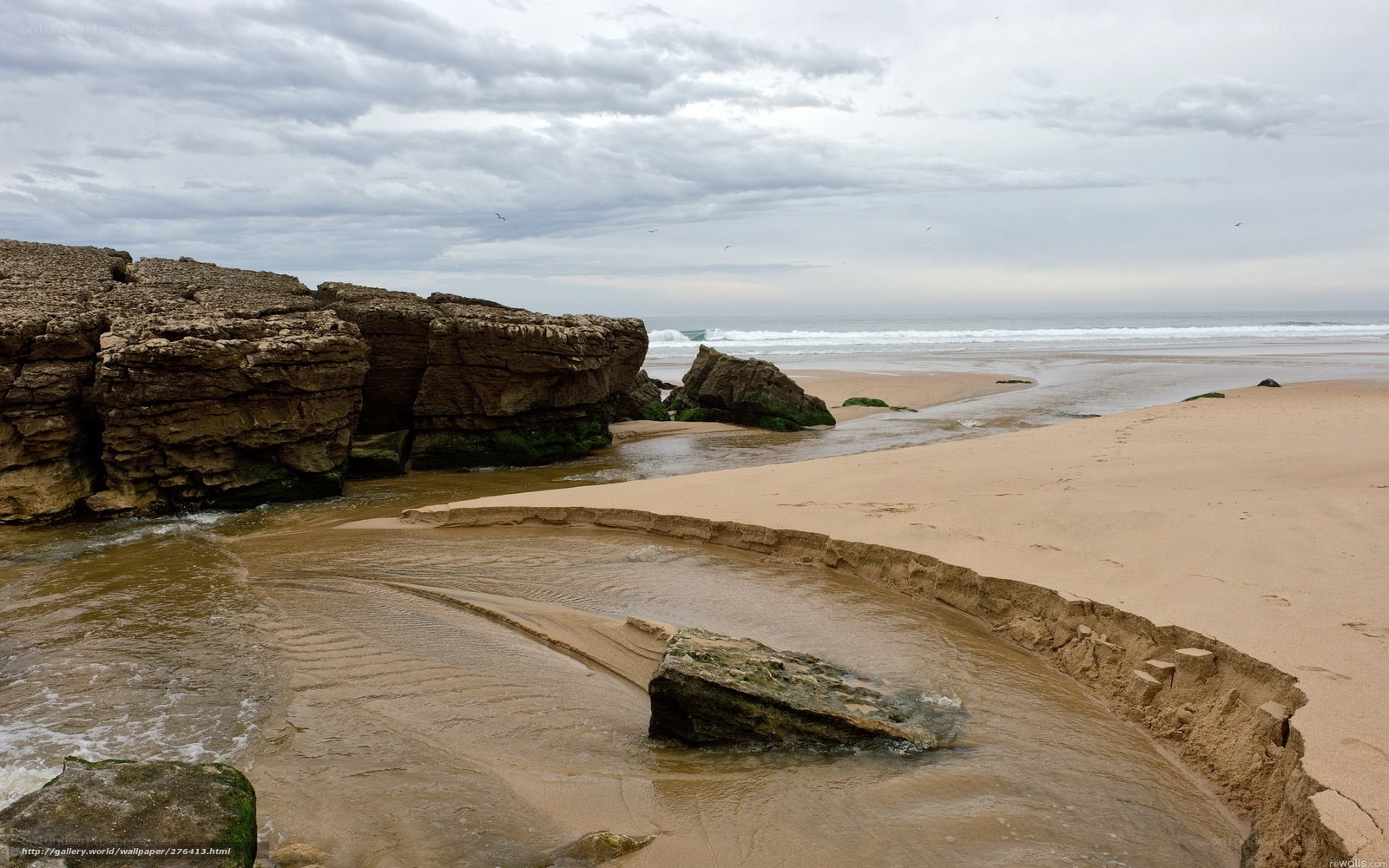 Rocky beach with stream