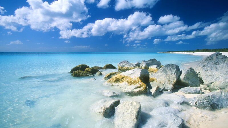 Rocky Beach with Turquoise Water — Blue, Serene, Afternoon, Photograph, Rocks, Ocean, Sky, Sand, White, Gray