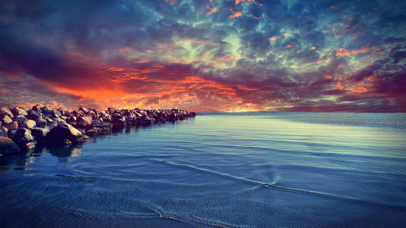 Rocky Breakwater at Sunset — Blue, Dramatic