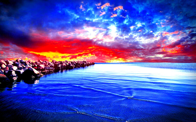 Rocky Breakwater at Sunset — Blue