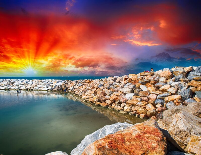 Rocky Breakwater at Sunset — Red