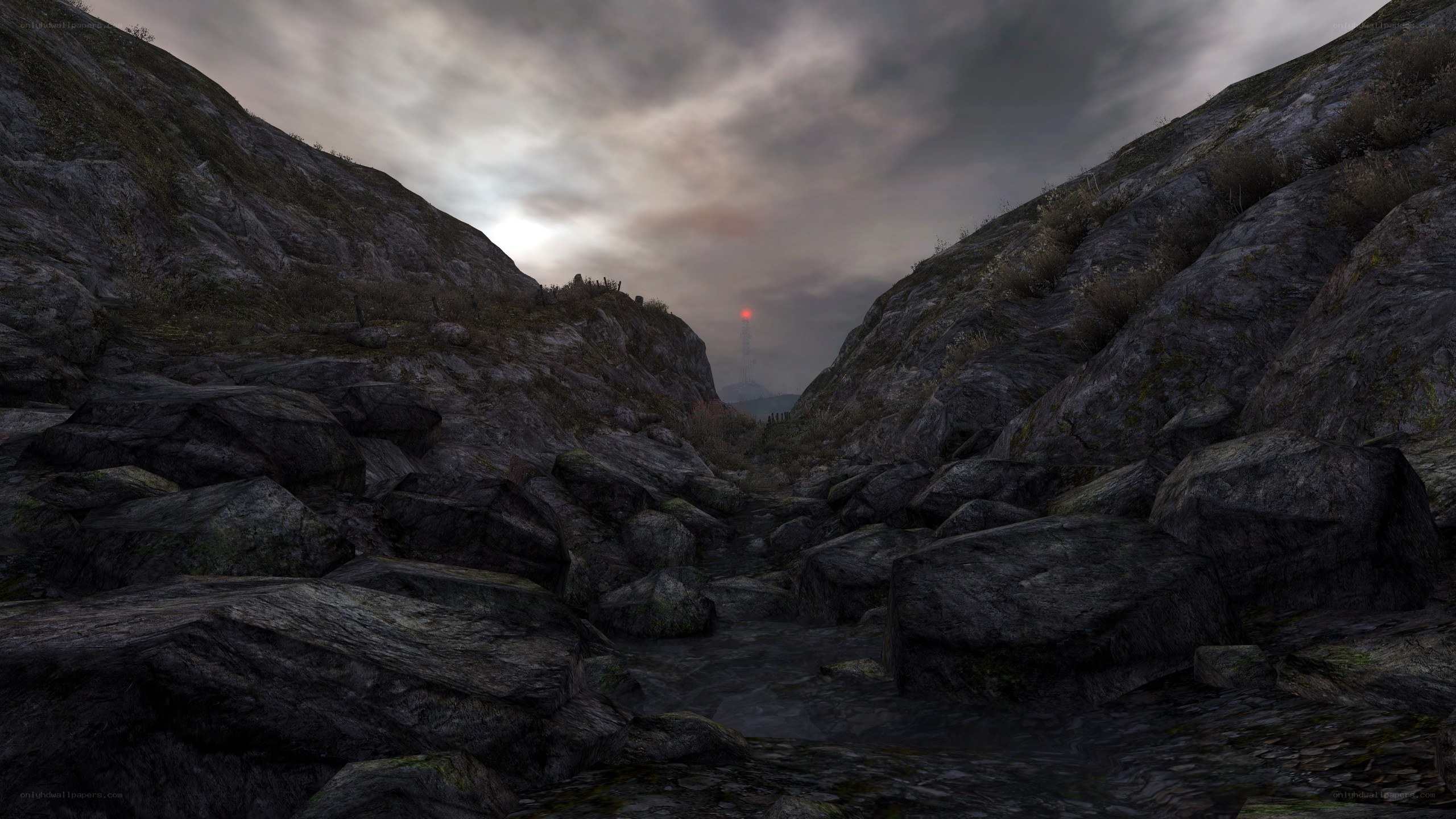 rocky canyon with distant tower
