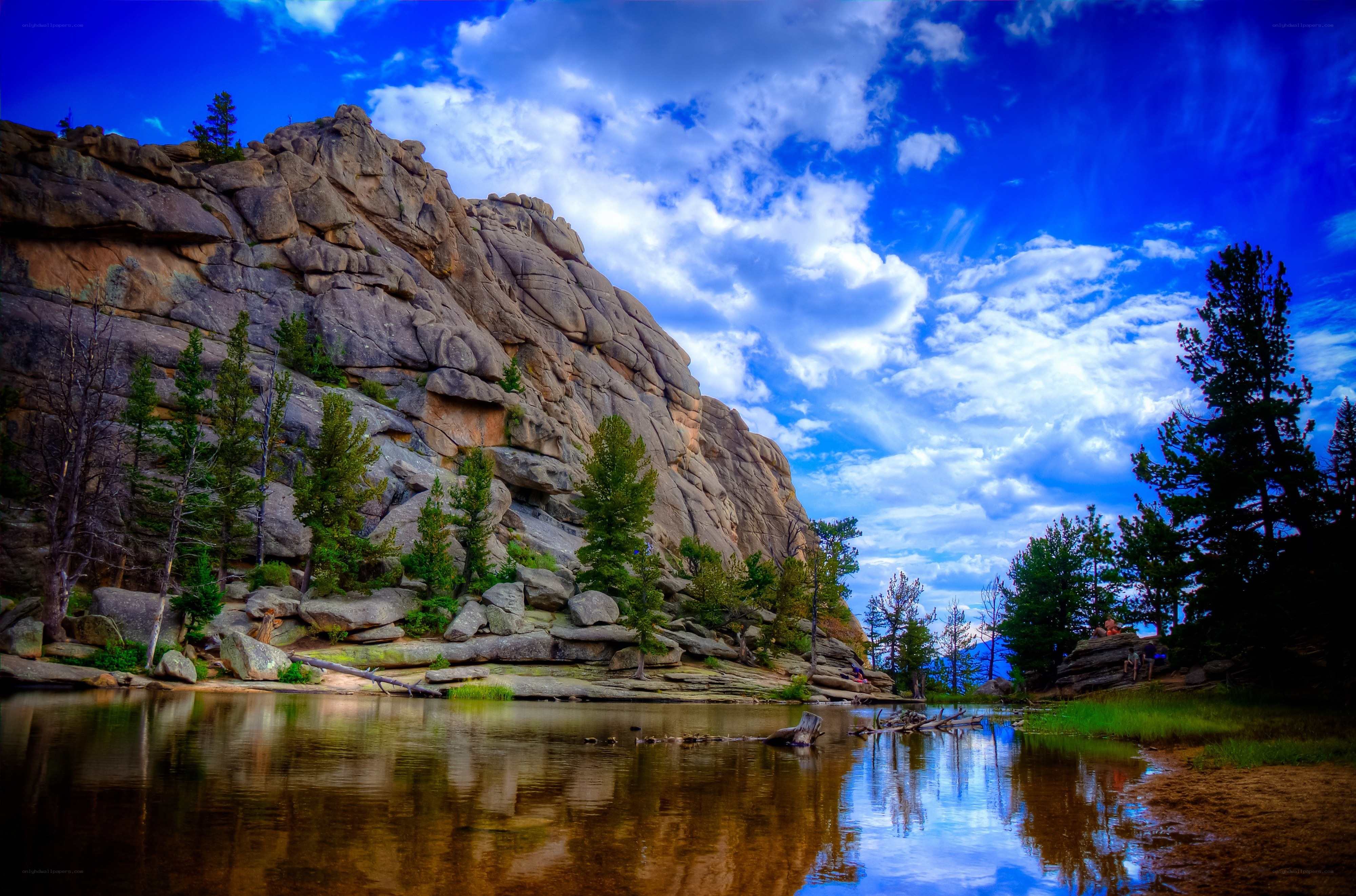 Rocky cliff by a calm lake
