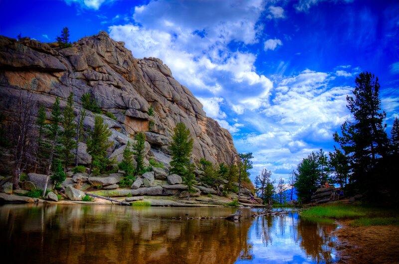 Rocky Cliff by Lake — Blue, Dramatic