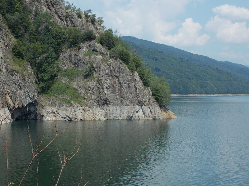 Rocky Cliff by Lake — Blue, Serene