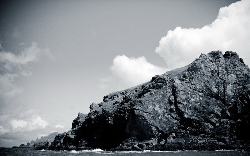 Rocky Cliff by Sea — Black