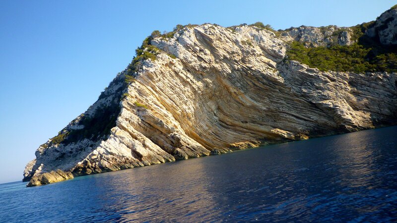 Rocky Cliff by Sea — Blue, Serene, Afternoon