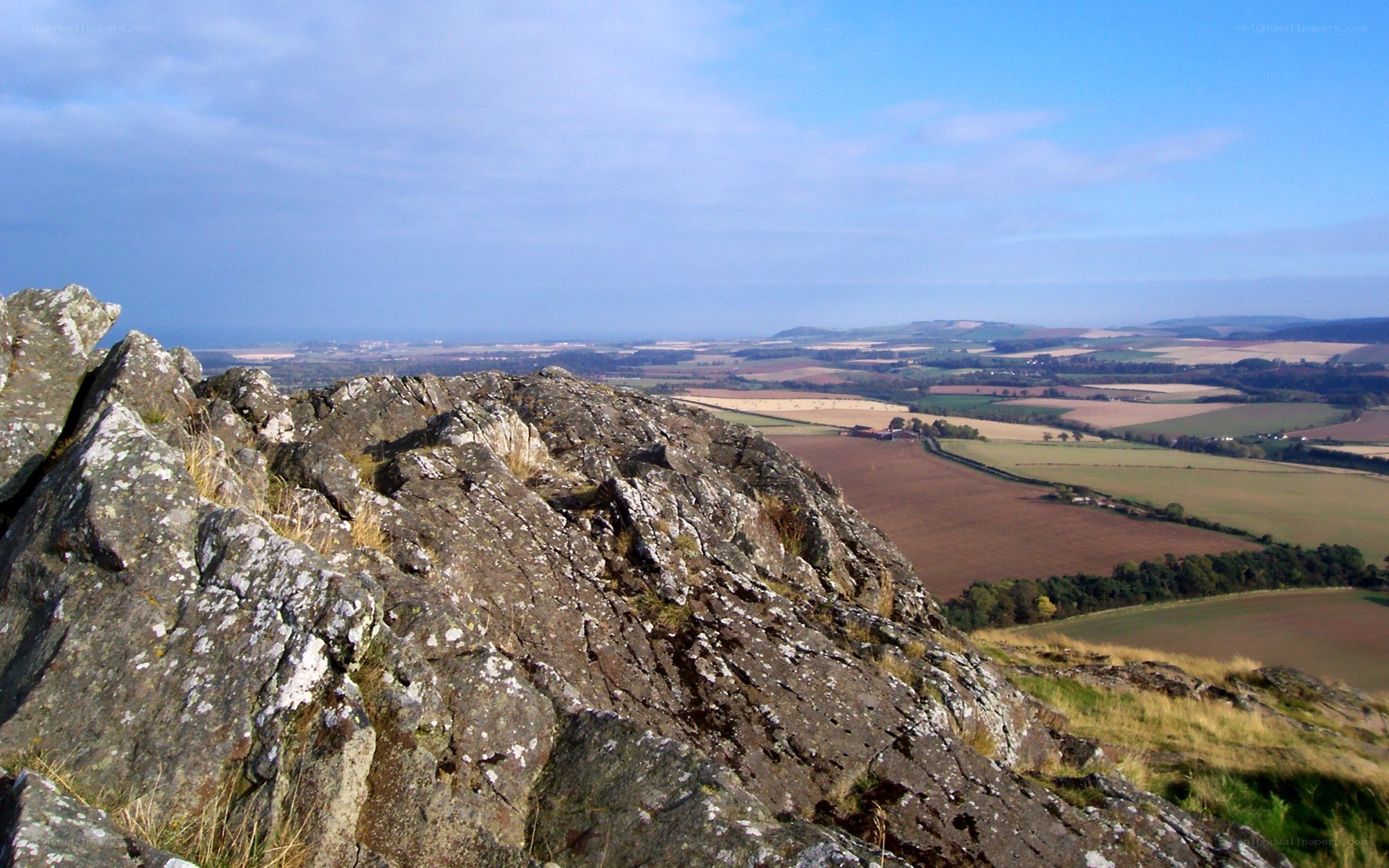 Rocky cliff overlooking farmland
