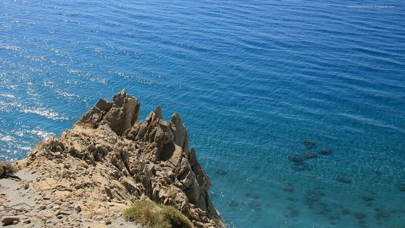 Rocky Cliff Overlooking Sea — Blue, Serene, Afternoon, Photograph, Rocks, Sky