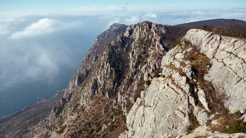 Rocky Cliff Overlooking Sea — Gray