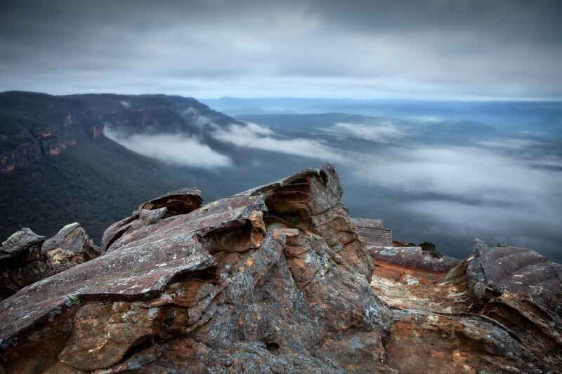 Rocky Cliff Overlooking Valley — Gray