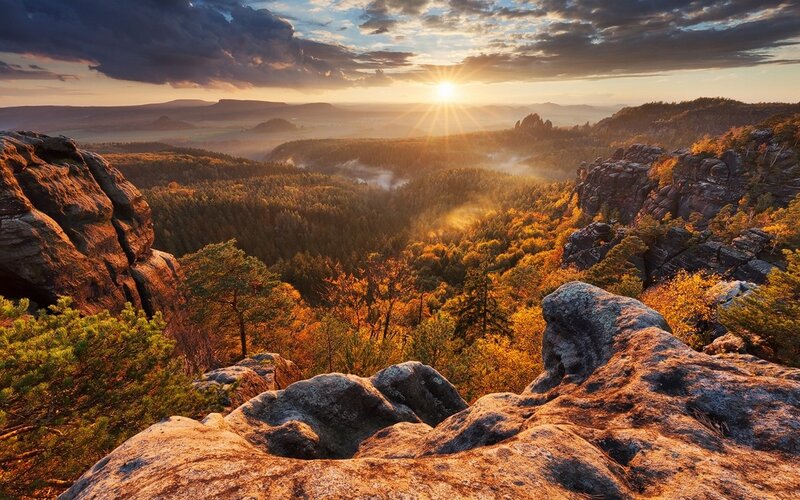 Rocky Cliff Overlooking Valley — Orange, Dramatic