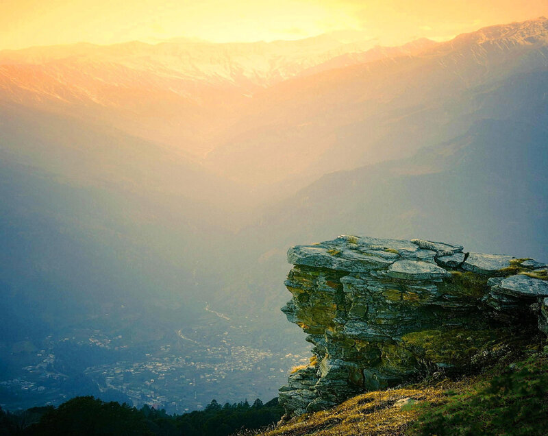 Rocky Cliff Overlooking Valley — Orange, Serene, Sunset