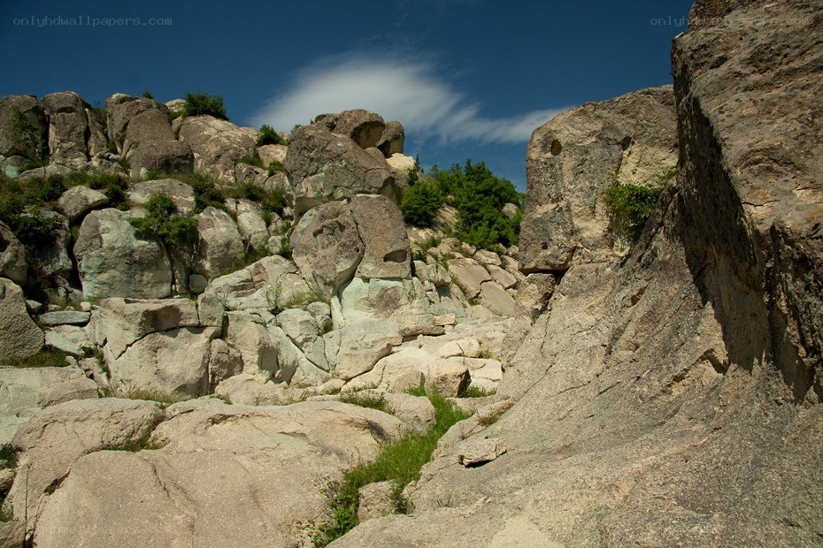 Rocky cliff under blue sky