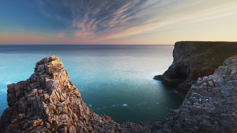 Rocky Cliffs at Sunset — Blue