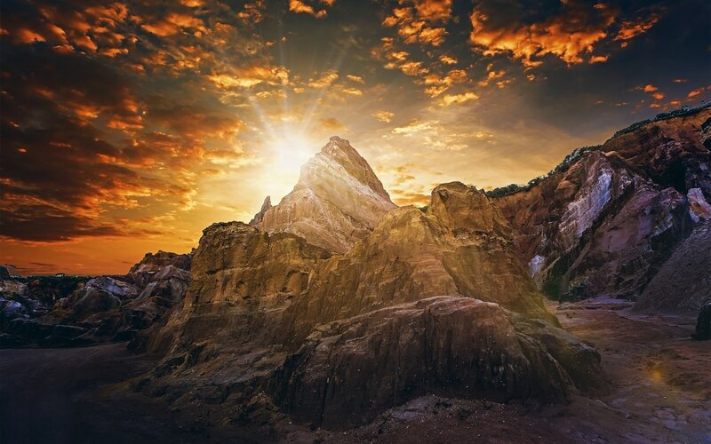 Rocky Cliffs at Sunset — Orange