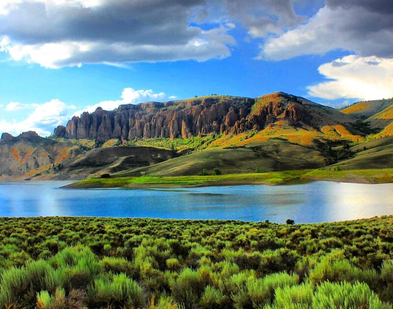 Rocky Cliffs by Lake — Blue, Dramatic, Afternoon