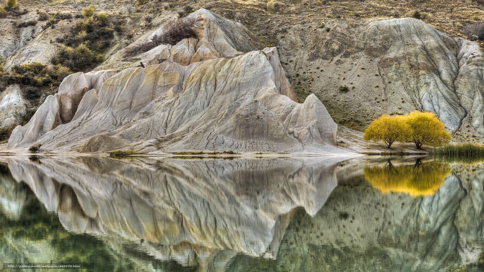 Rocky cliffs reflected in lake
