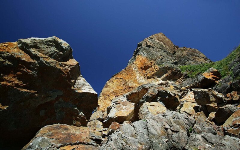 rocky cliffs under blue sky