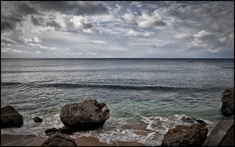Rocky coast under cloudy sky