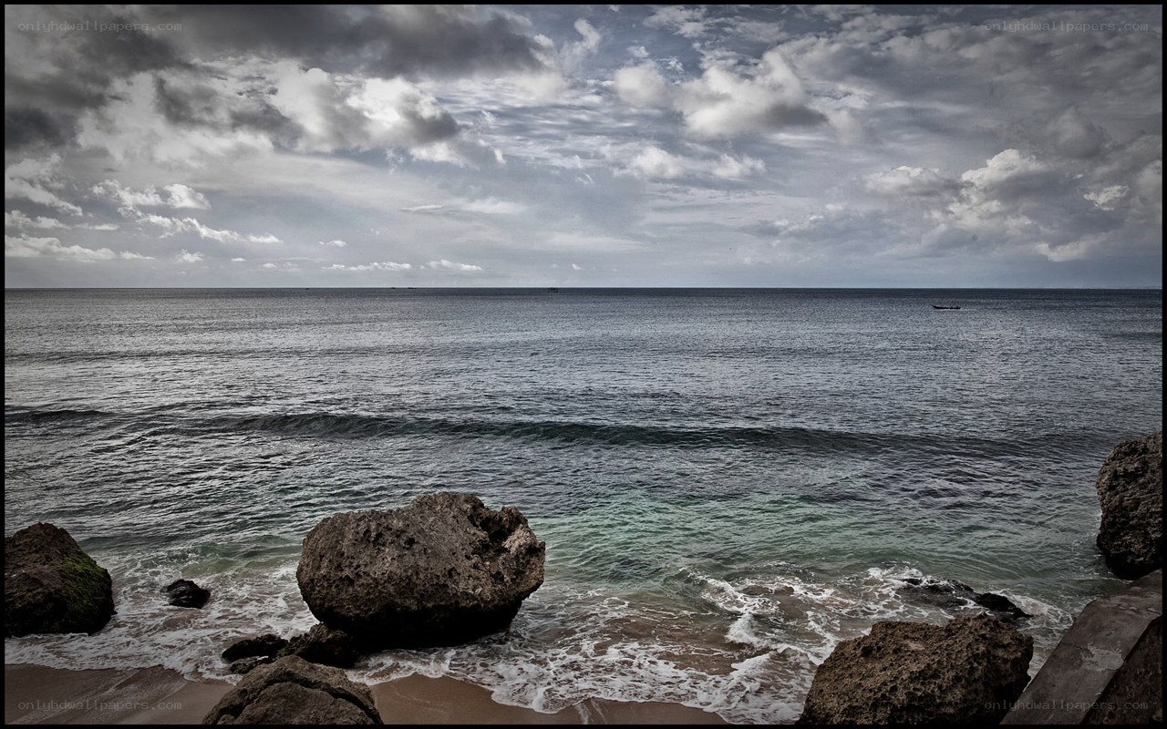 Rocky coast under cloudy sky