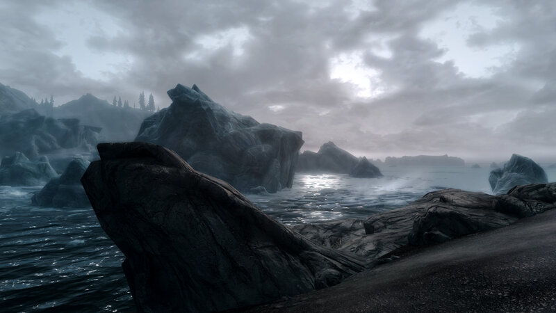 rocky coast under cloudy sky