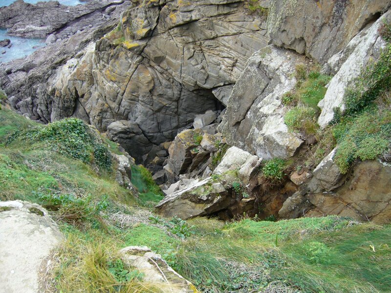 rocky coastal cliff with sea