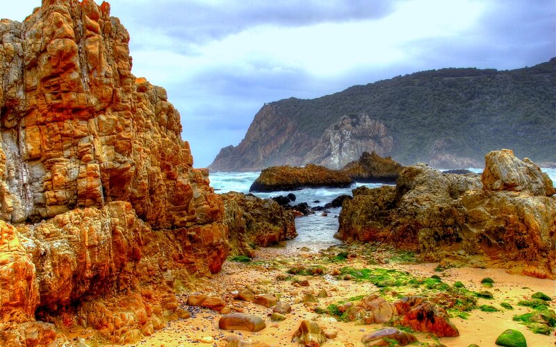 Rocky Coastal Inlet — Orange, Dramatic