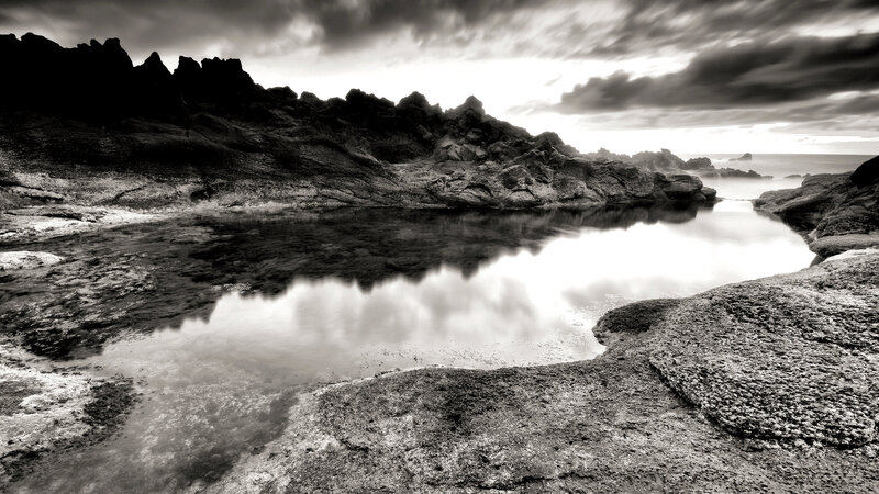 Rocky coastal pool at dusk