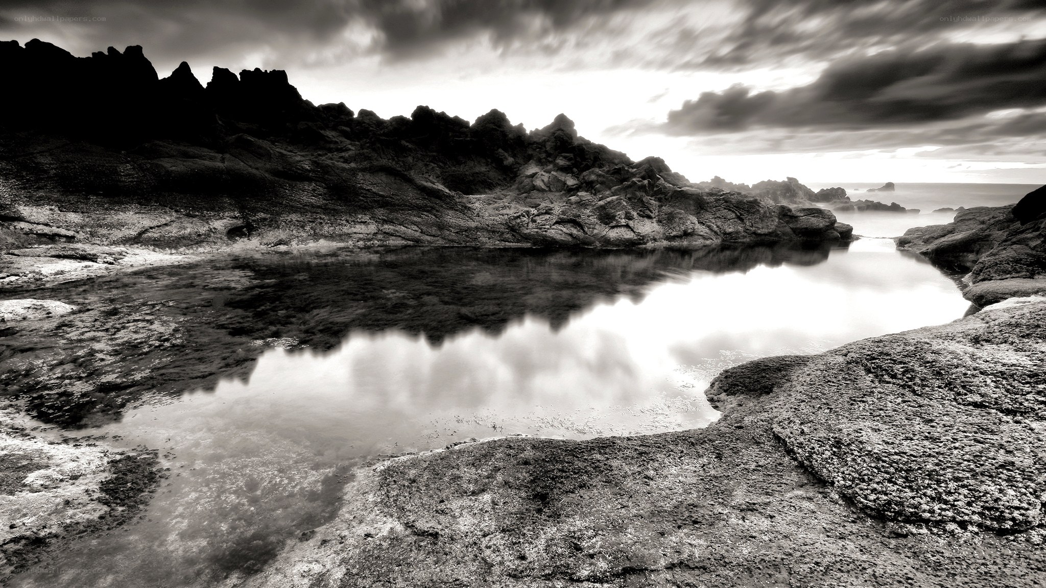 Rocky coastal pool at dusk