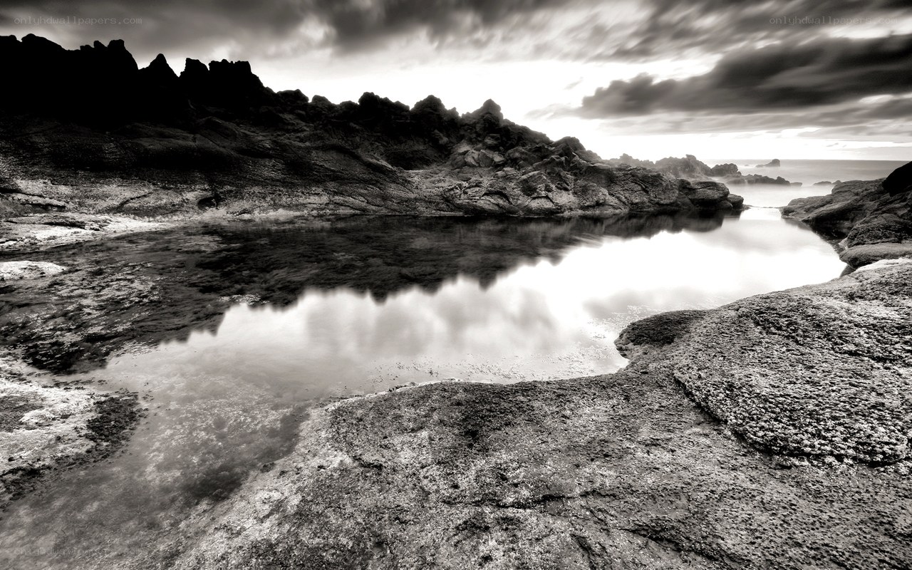 Rocky coastal pool at dusk