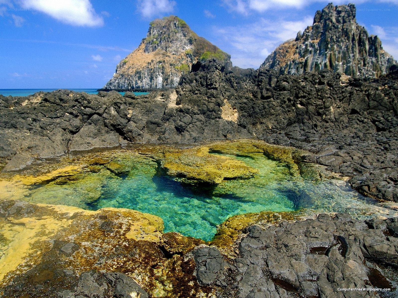 rocky coastal pool with sea stacks