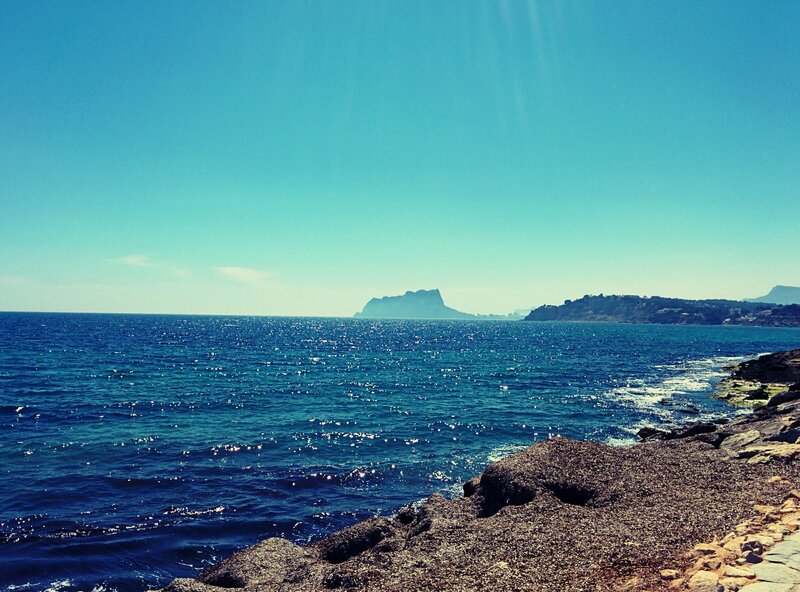 Rocky Coastline and Sea — Blue, Serene, Afternoon, Photograph, Island