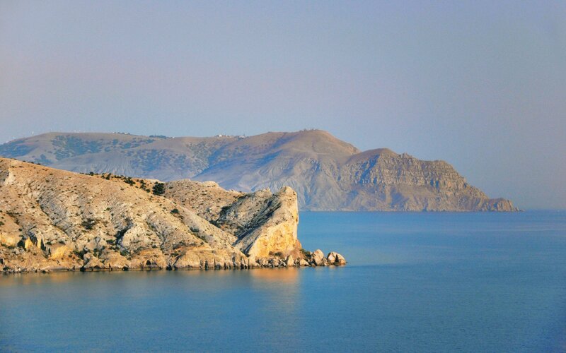 Rocky Coastline and Sea — Blue, Serene, Afternoon, Photograph, Mountains, Cliffs