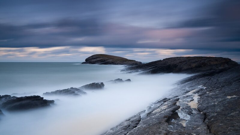 Rocky Coastline at Dusk — Blue, Dramatic, Sunset, Photograph, Rocks, Sea, Clouds, Gray, White
