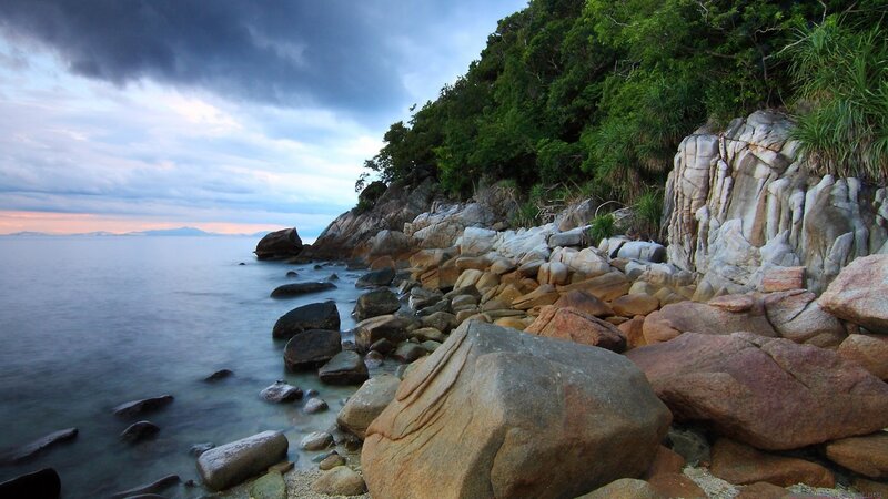 Rocky Coastline at Dusk — Blue, Dramatic, Sunset, Photograph, Rocks, Sea, Trees, Clouds, Green