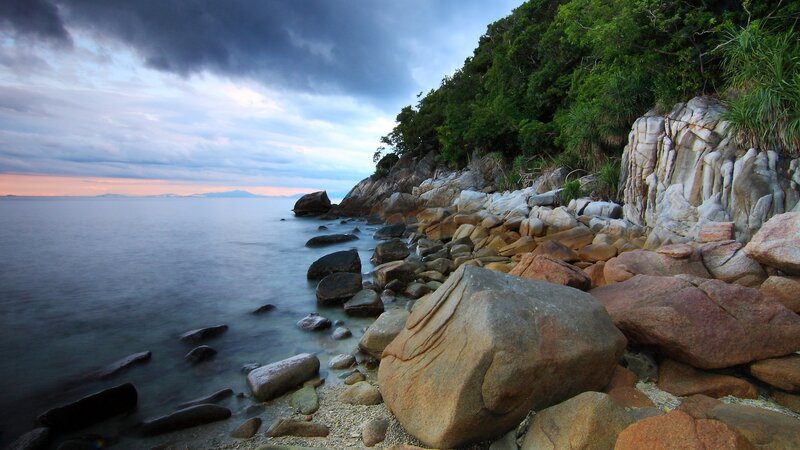 Rocky Coastline at Dusk — Blue, Dramatic, Sunset, Photograph, Rocks, Sea, Trees, Sky