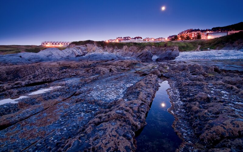 Rocky Coastline at Dusk — Blue, Serene, Night, Photograph, Moon