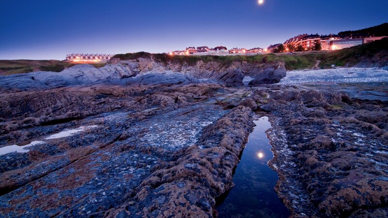 Rocky Coastline at Dusk — Blue, Serene, Night
