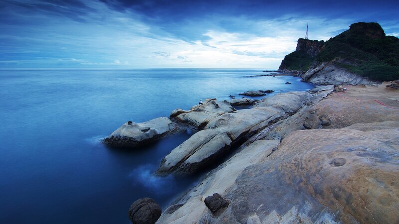 Rocky Coastline at Dusk — Blue, Serene, Photograph, Ocean