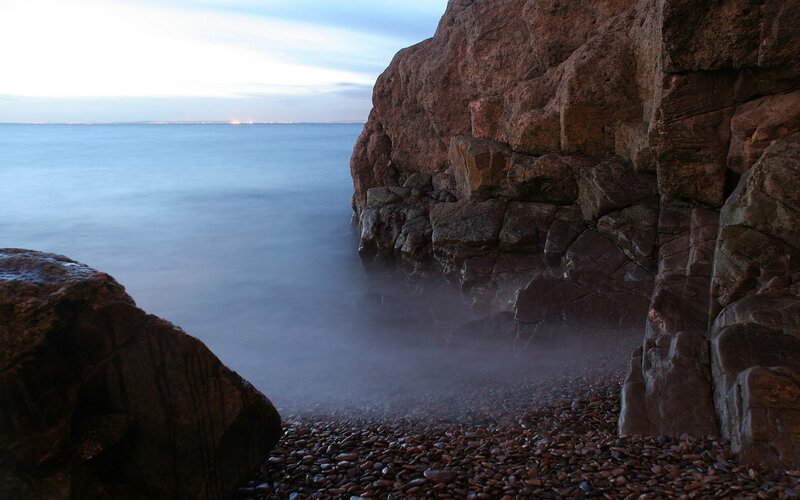 Rocky Coastline at Dusk — Blue, Serene, Photograph, Rocks, Sea, Pebbles, Mist