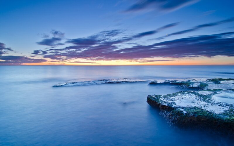 Rocky Coastline at Dusk — Blue, Serene, Sunset, Photograph, Ocean, Sky, Moon