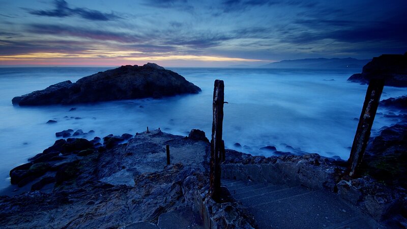 Rocky Coastline at Dusk — Blue, Serene, Sunset, Photograph, Rocks, Ocean, Stairs