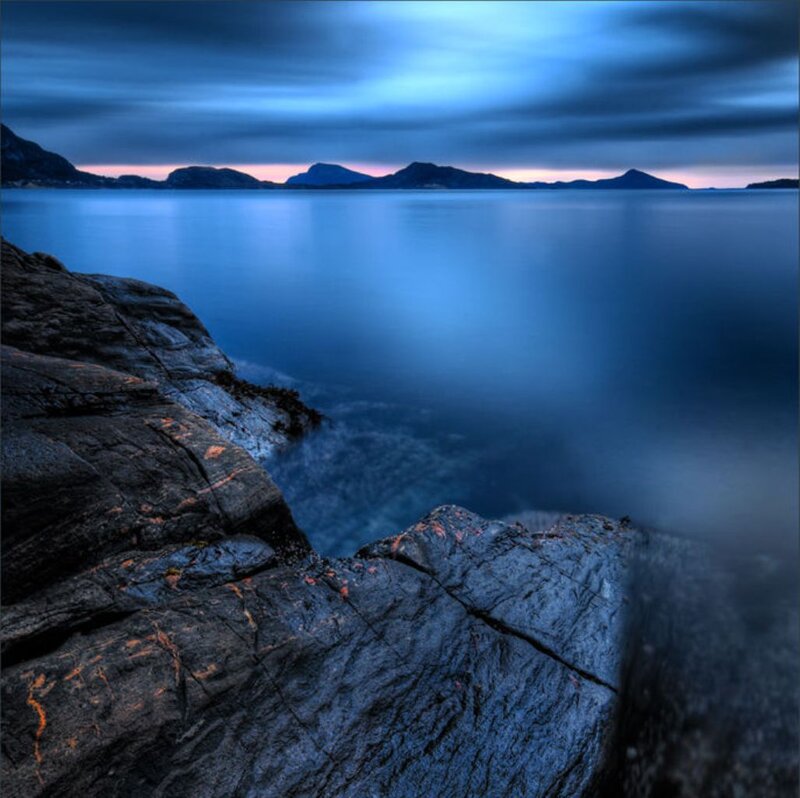 Rocky Coastline at Dusk — Blue, Serene, Sunset, Photograph, Rocks, Sea