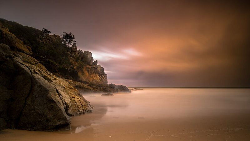 Rocky Coastline at Dusk — Orange