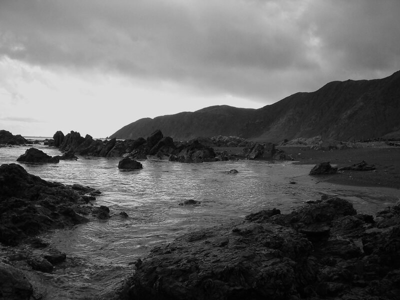 Rocky Coastline at Low Tide — Black