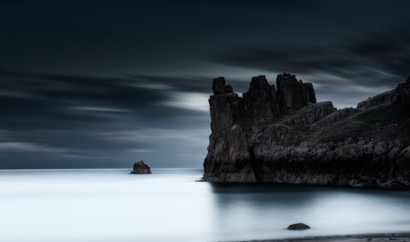 Rocky Coastline at Night — Blue, Dramatic, Photograph