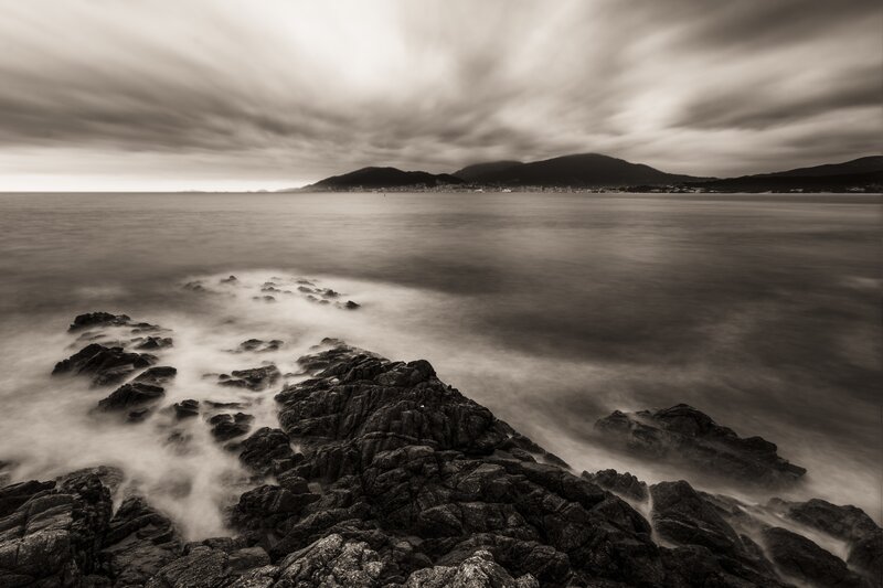 Rocky Coastline at Sea — Black, Dramatic, Photograph